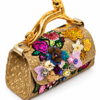 Corvane MAJESTA 4276 top handle bag, side view showing tan-beige jacquard lace, light metallic gold leather and sculptural gold-tone leopard handle