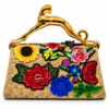 Corvane MAJESTA 4276 top handle bag, back view showing tan-beige jacquard lace with colourful floral embellishment and sculptural gold-tone leopard handle