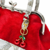 Sísí Èkó Àrà Scarlet Silver close-up showing scarlet red hair-on-hide leather, silver-tone frame and optional bag charm sold separately