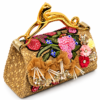 ALT Text: Corvane MAJESTA 8426 top handle bag, front-side angled view showing tan-beige jacquard lace, dimensional botanical embellishment and gold-tone leopard handle