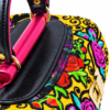 Close-up of HelaSol Roidery Midi 2845 showing layered floral Roidery, black scrollwork, yellow suede leather and fuchsia handlebar detail