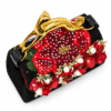 Corvane MAJESTA 6914 top angled view showing black jacquard lace, dimensional red florals, pearl accents and sculptural gold-tone leopard handle