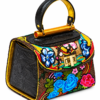 HelaSol Roidery Midi 7641 multicolour floral Roidery handbag, front-side angled view showing deep chocolate-brown Baroque-stencilled leather side panel