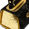 HelaSol AL MMidi Noir Doré structured handbag, close up side view showing light gold foil-on-leather side panel and gold side piping