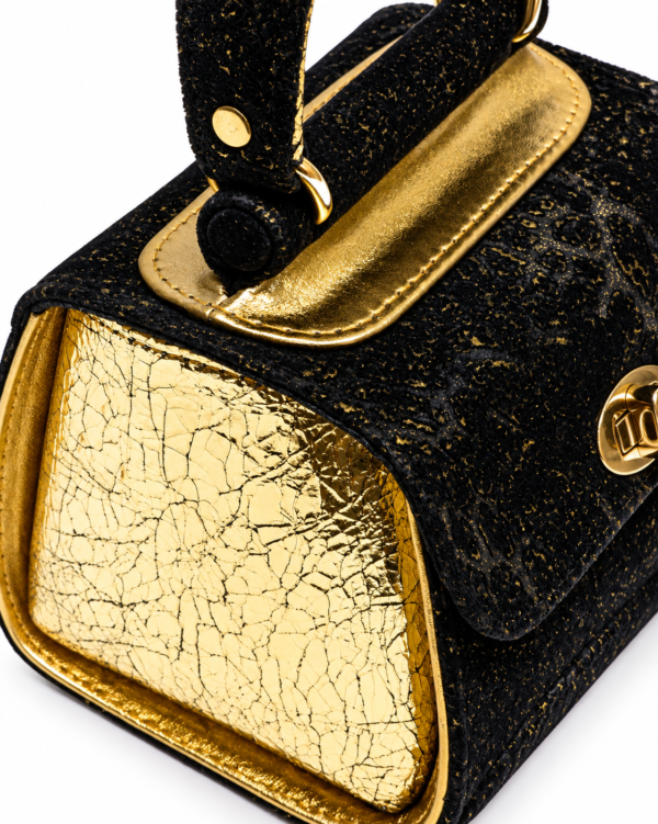 HelaSol AL MMidi Noir Doré structured handbag, close up side view showing light gold foil-on-leather side panel and gold side piping