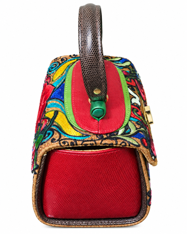 HelaSol Roidery Midi 5816 handbag, top angle view showing red textured leather side panel, green metallic handlebar detail, deep brown top handle and multicolour Roidery across the upper body.